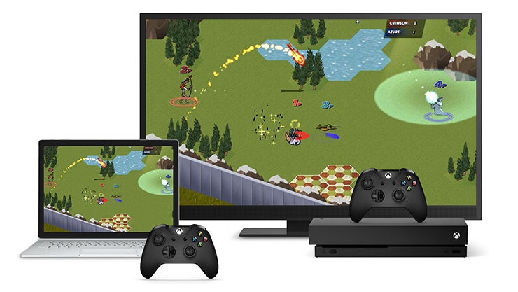 Una laptop y una consola Xbox ejecutan un juego al mismo tiempo